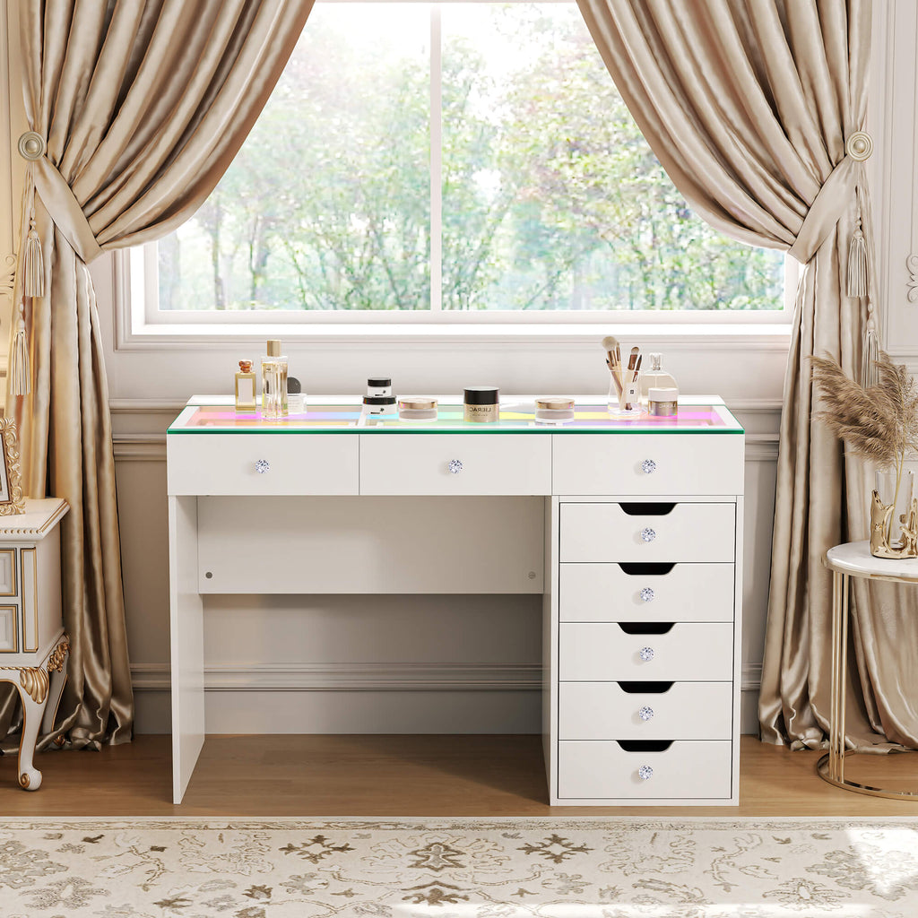 Vanitii Diana vanity desk with eight storage drawers and glass top in a room with curtains