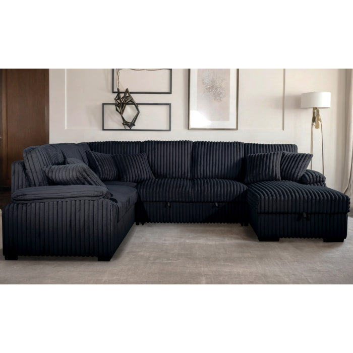 Black sectional sofa in a living room setting with decor elements.