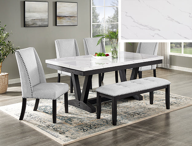 Dining room set with a table, chairs, and bench on a rug.