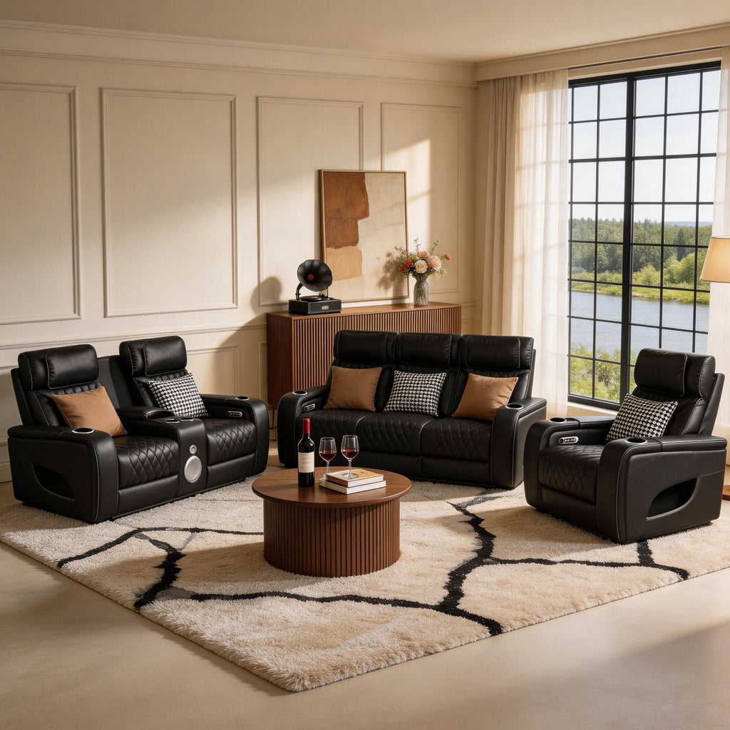 Modern living room with black leather recliner sofa set and round wooden coffee table.