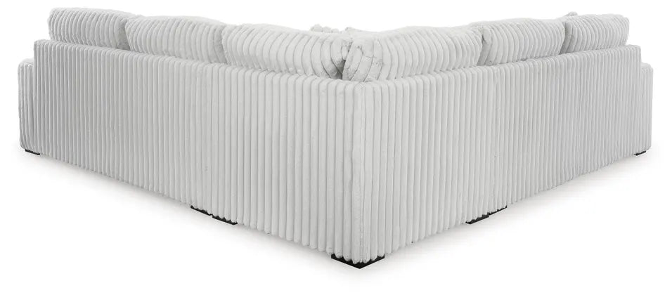 Back of a light gray L shaped sectional on a white background