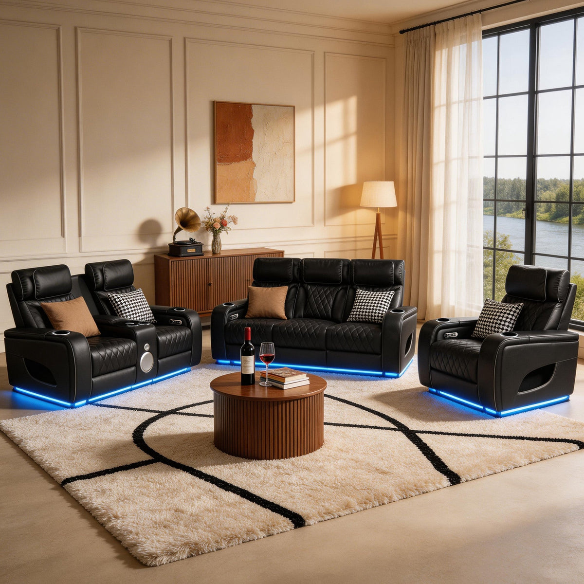 Modern living room with black leather recliner chairs, a coffee table, and decorative elements.