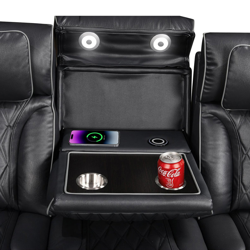 Black leather recliner with cup holder, phone, and Coca-Cola can on a white background