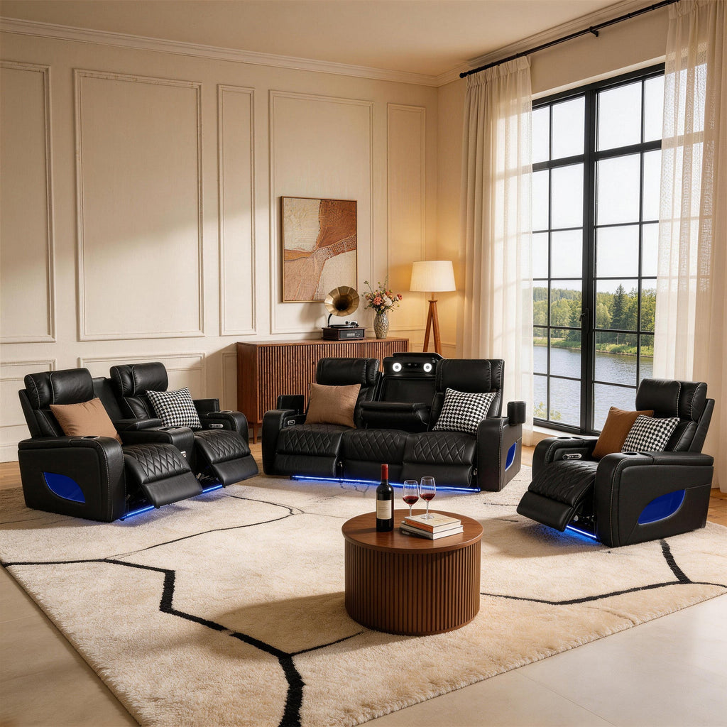 Modern home theater setup with black recliner chairs and a wooden coffee table.
