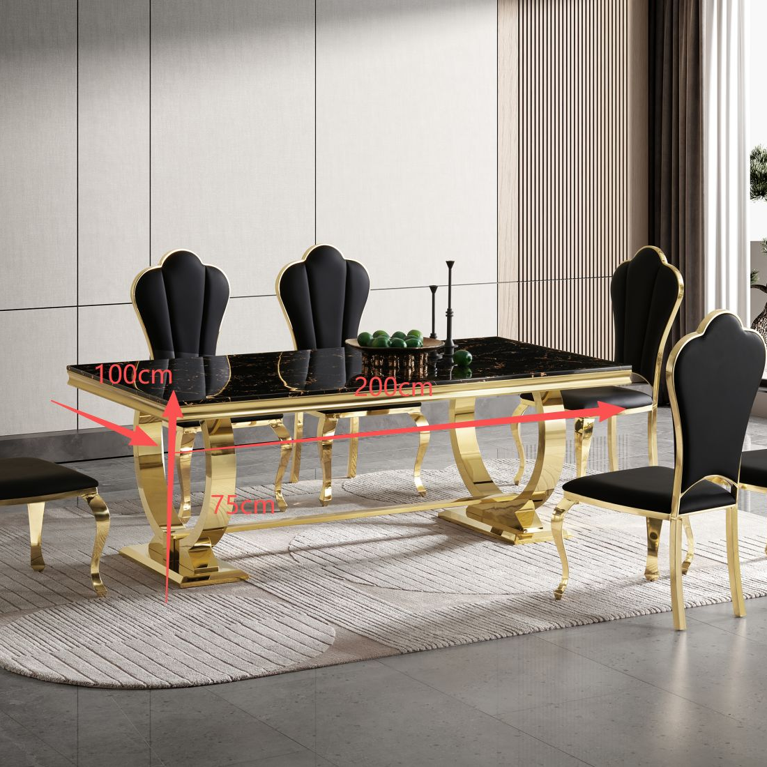 Dining table set with black chairs and gold legs in a modern room.