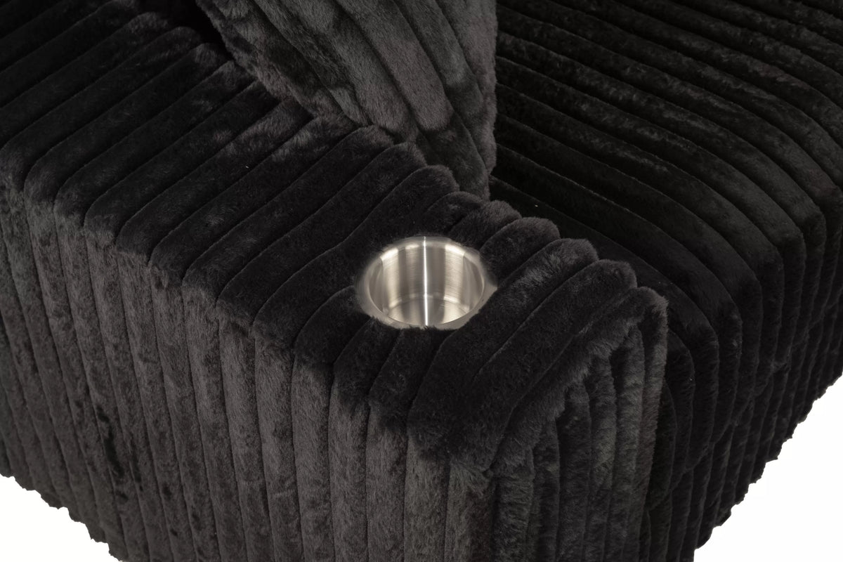 Close up of cup holder on black couch.