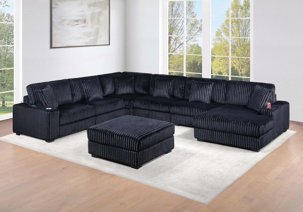 Black corduroy sectional set in a modern living room.