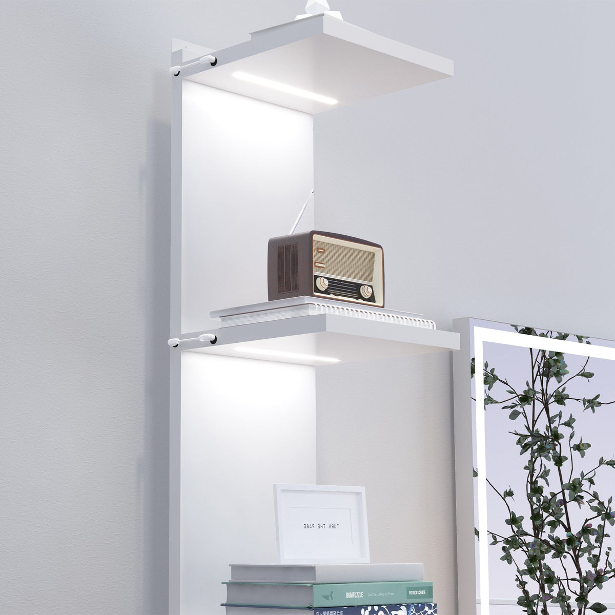 Vanitii white wall mounted display shelves with integrated LED lighting holding books and a vintage radio