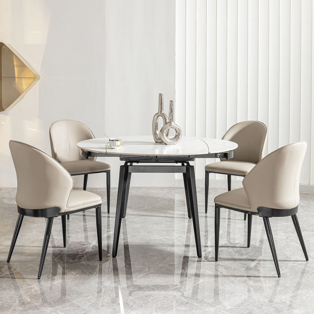Dining room with a round table and four chairs in a modern interior setting.