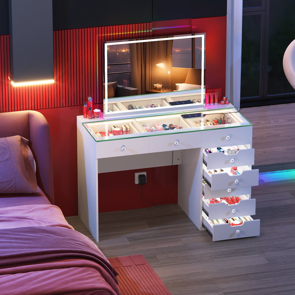 Vanitii Diana white vanity desk with lighted mirror and eight storage drawers filled with cosmetics