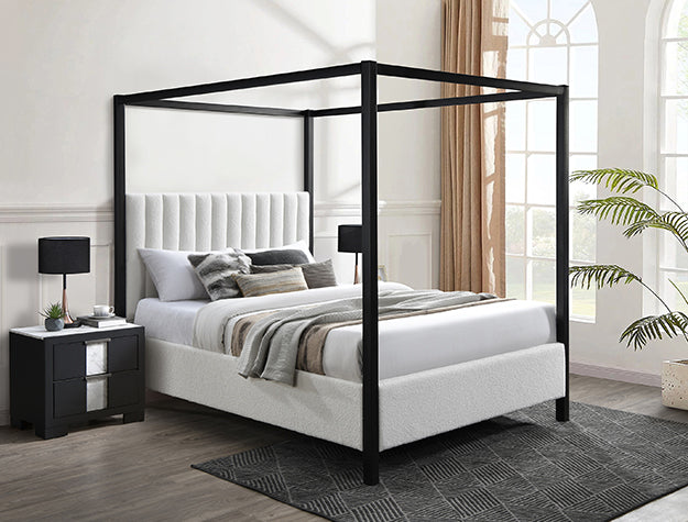 Bedroom with a four-post canopy bed, nightstands, and decor elements.