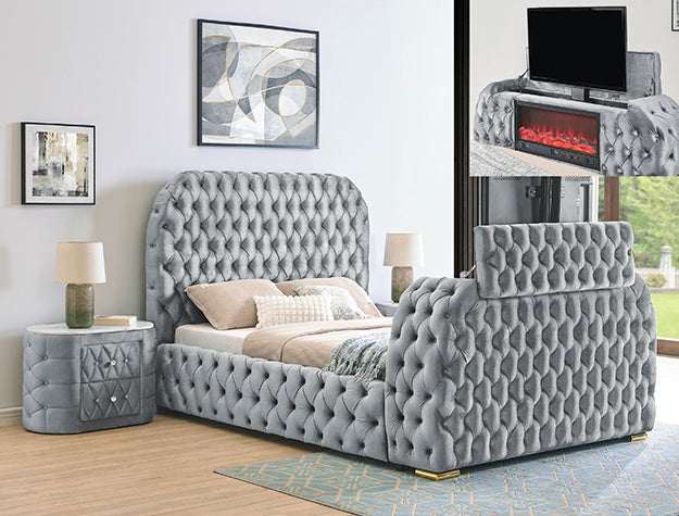 Gray tufted bed in a bedroom setting with nightstands and decor.