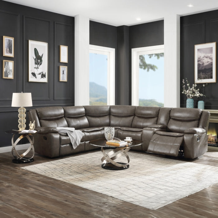 Brown leather sectional sofa in a living room with dark walls and large windows.