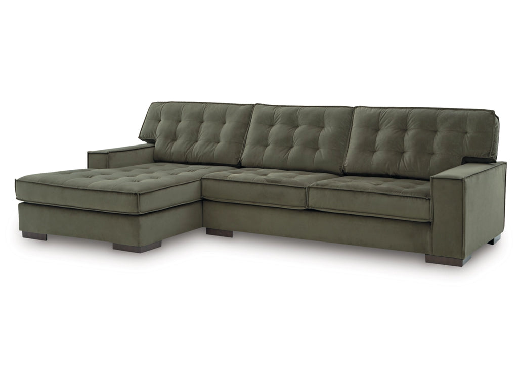 Green sectional sofa on a white background