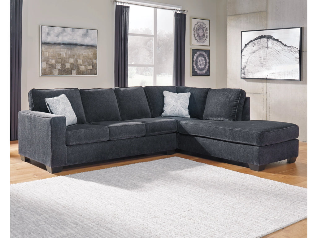 Gray sectional sofa in a living room with decor elements.