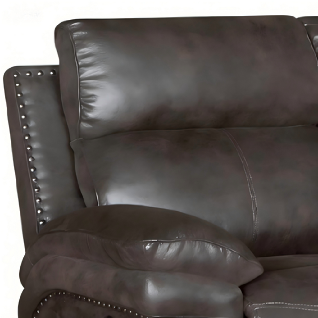 Close-up of a dark brown leather sofa with studded details.