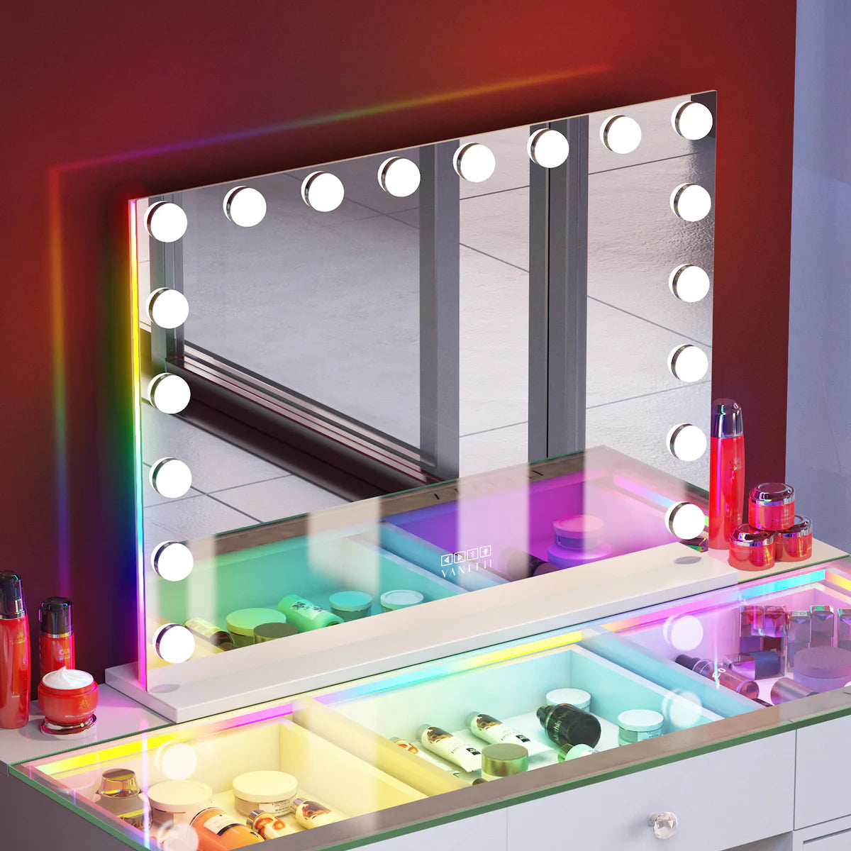 Makeup vanity with a large mirror surrounded by colorful lights and makeup products.