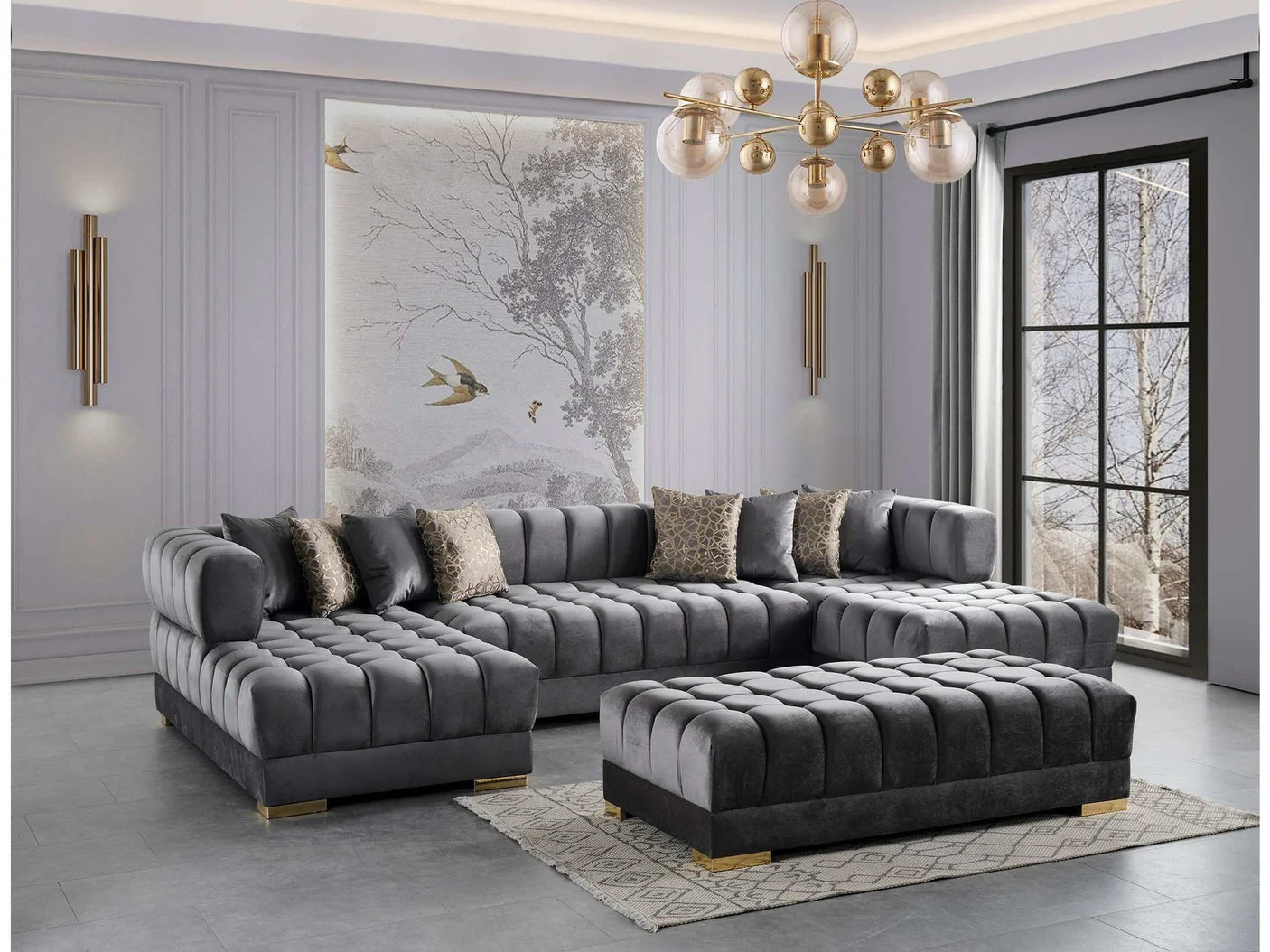 Gray sectional sofa in a modern living room with a chandelier and artwork on the wall.