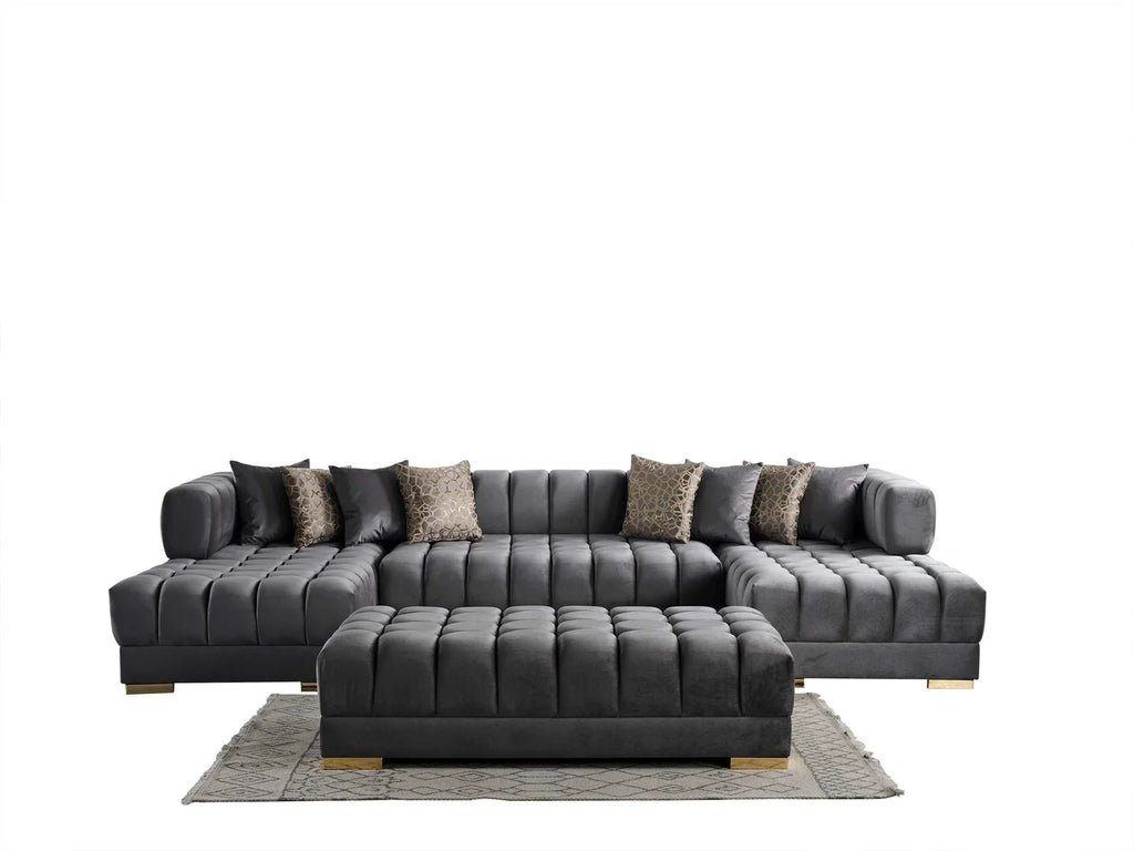 Gray sectional sofa with patterned cushions and a matching ottoman on a white background