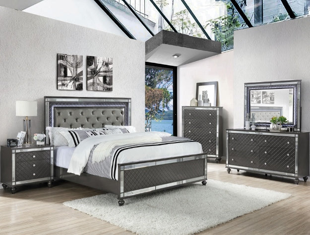 Modern bedroom with gray upholstered bed, nightstands, and dresser.