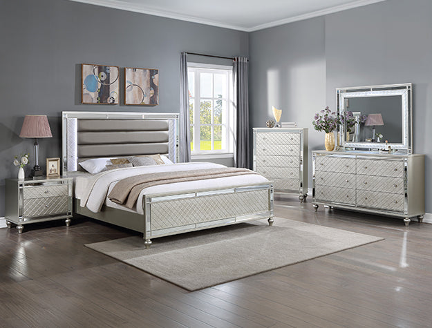 Silver bedroom set with mirror accents in a modern room.