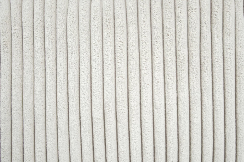 Close-up of textured white fabric with a subtle pattern