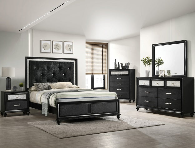 Black bedroom furniture set with bed, dresser, and mirror in a room.