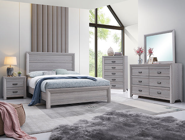 Gray bedroom furniture set with bed, dresser, and nightstands in a bright room.