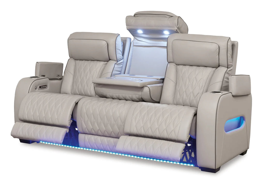 Gray recliner sofa with LED lighting on a white background
