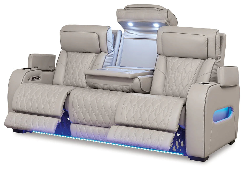 Gray recliner sofa with LED lighting on a white background
