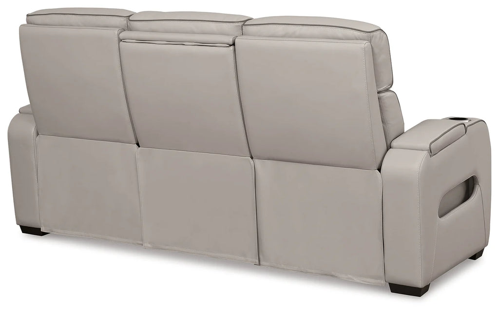 Gray sofa with reclining feature on a white background