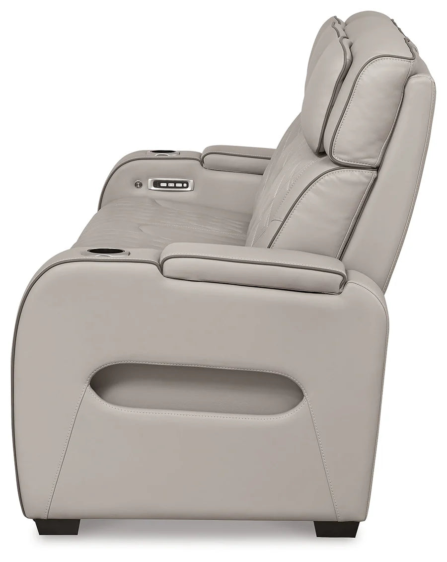 Gray power recliner chair with cup holder on a white background