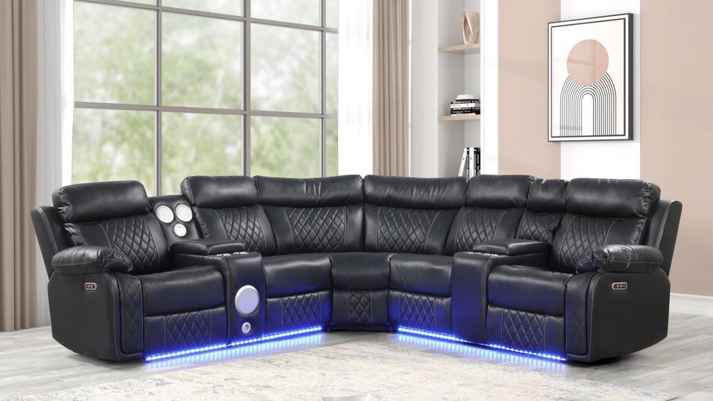 Black faux leather power reclining sectional with LED lights, built-in Bluetooth speakers, and quilted diamond stitching and modern curved design in contemporary living room.