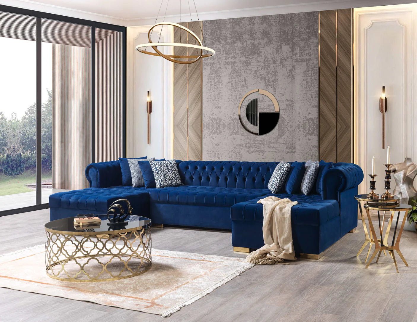 Modern living room with a blue sofa, gold coffee table, and decorative elements.