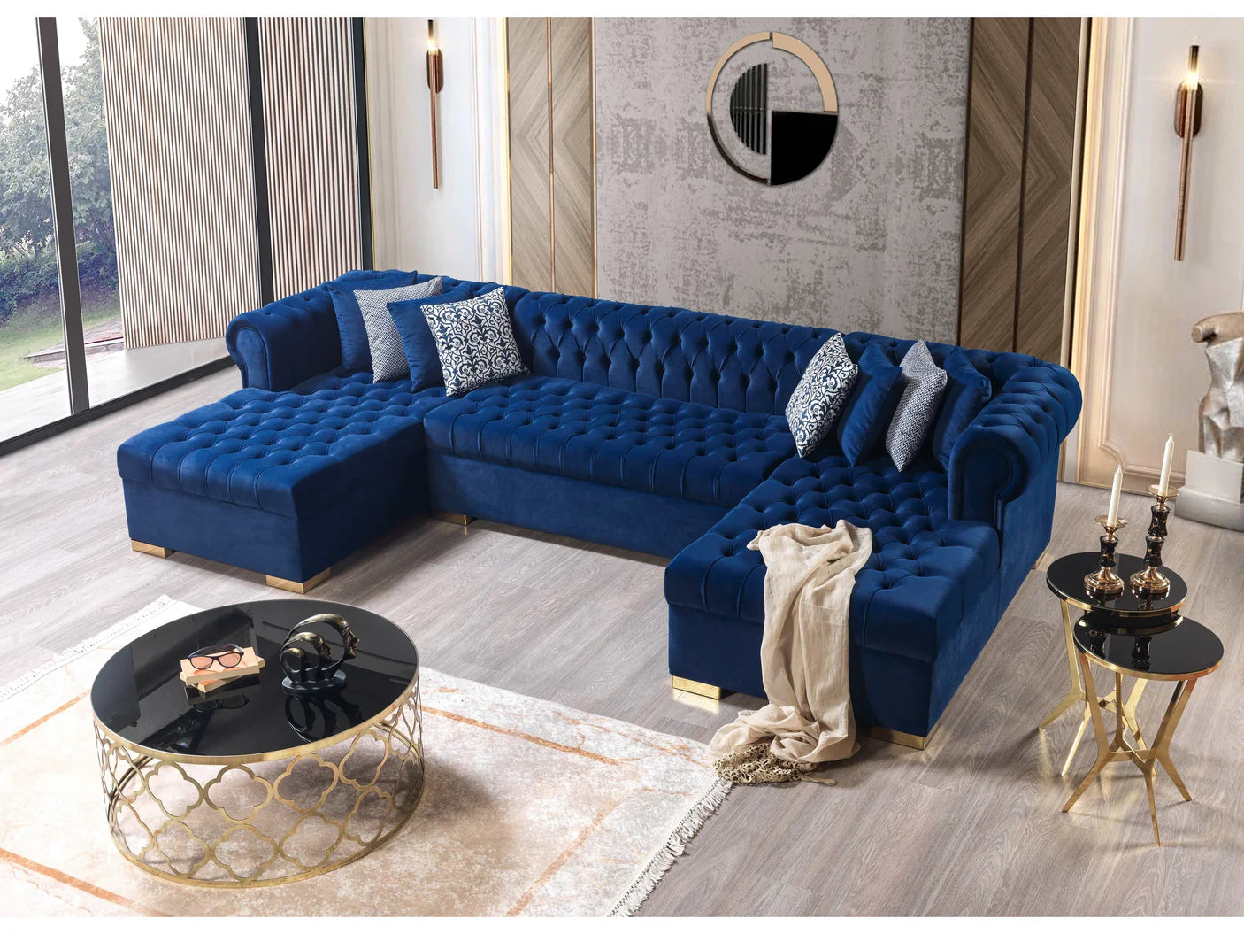 Blue tufted sectional sofa in a modern living room with decorative pillows and side tables.