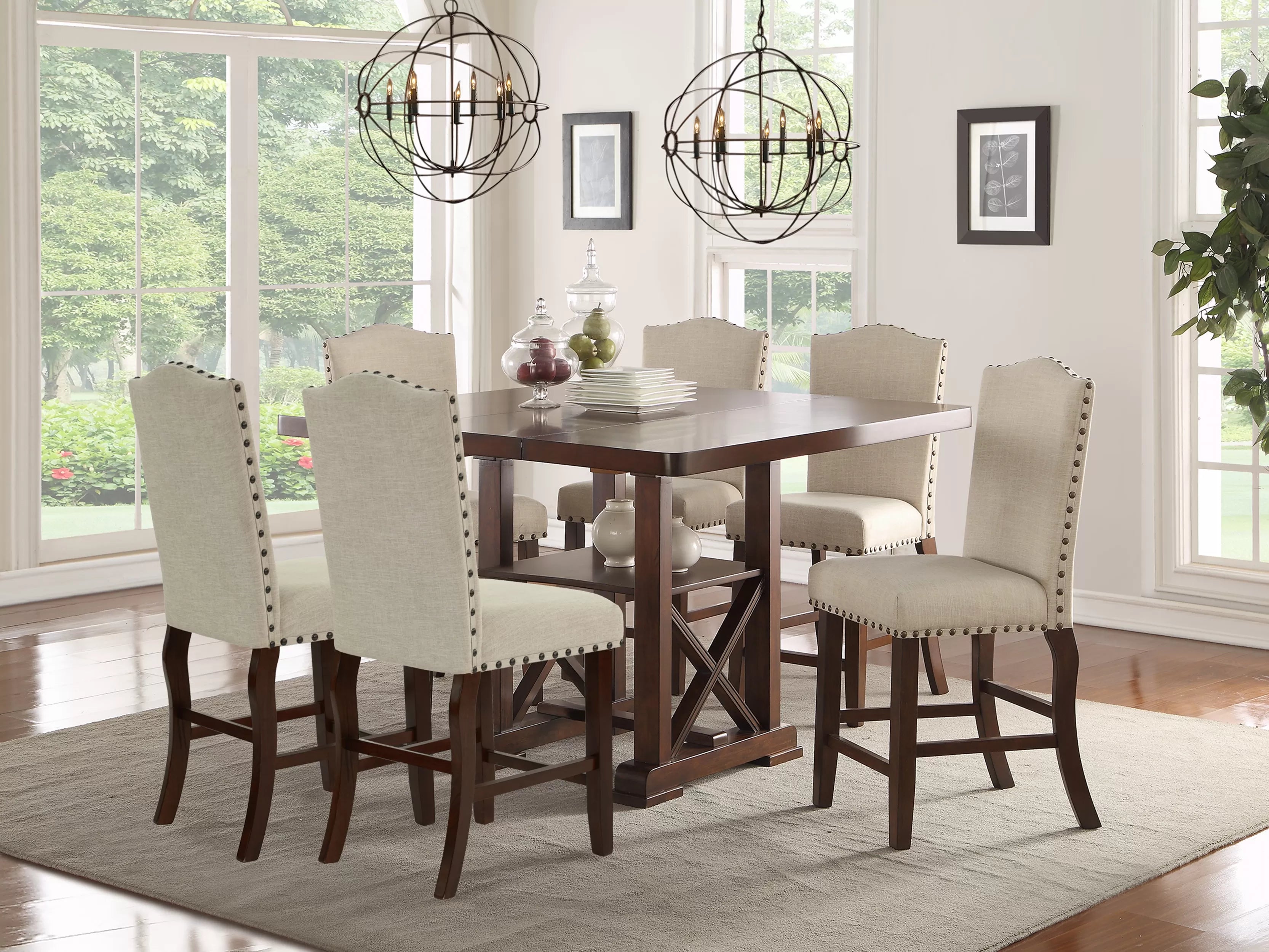 Dining room with a wooden table and six chairs in a well-lit room.