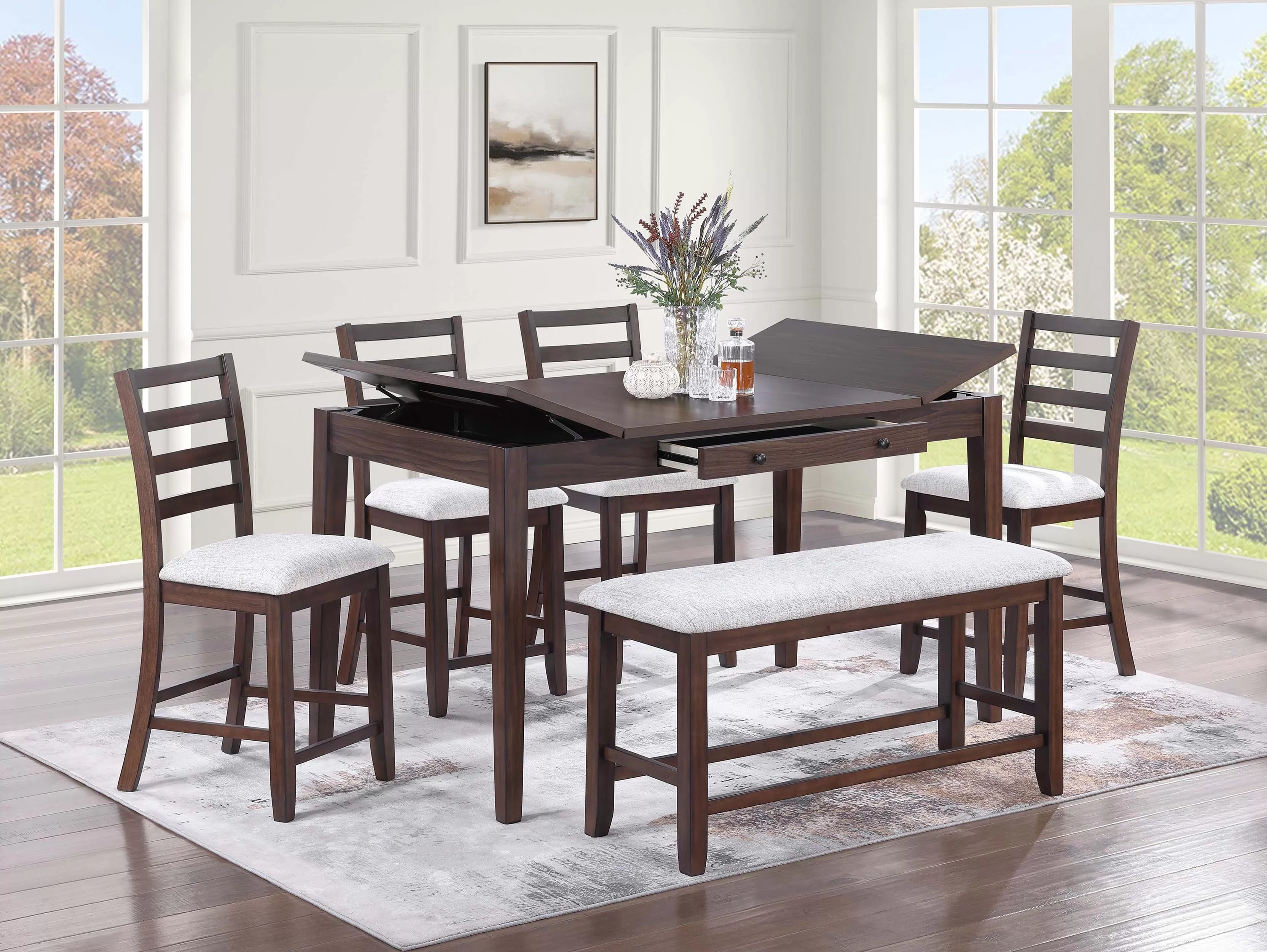 Dining room set with a dark wood table and chairs on a light rug.