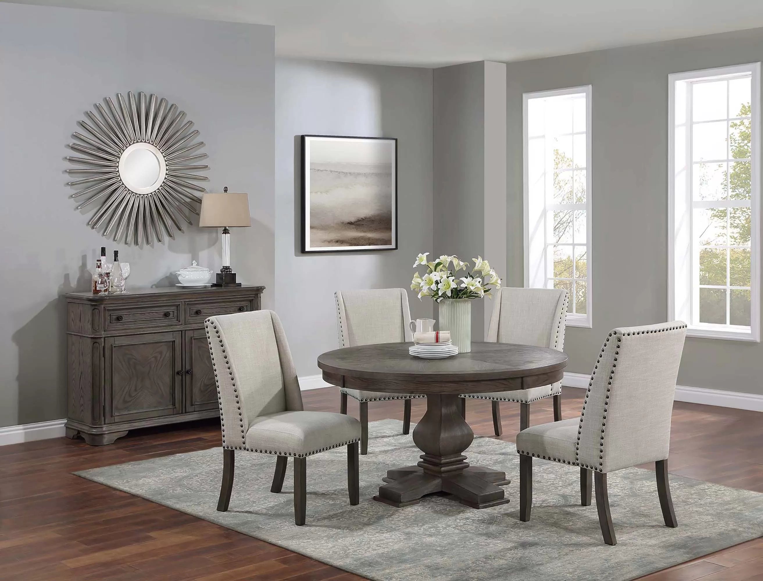 Dining room with wooden table and chairs in a well-lit room.