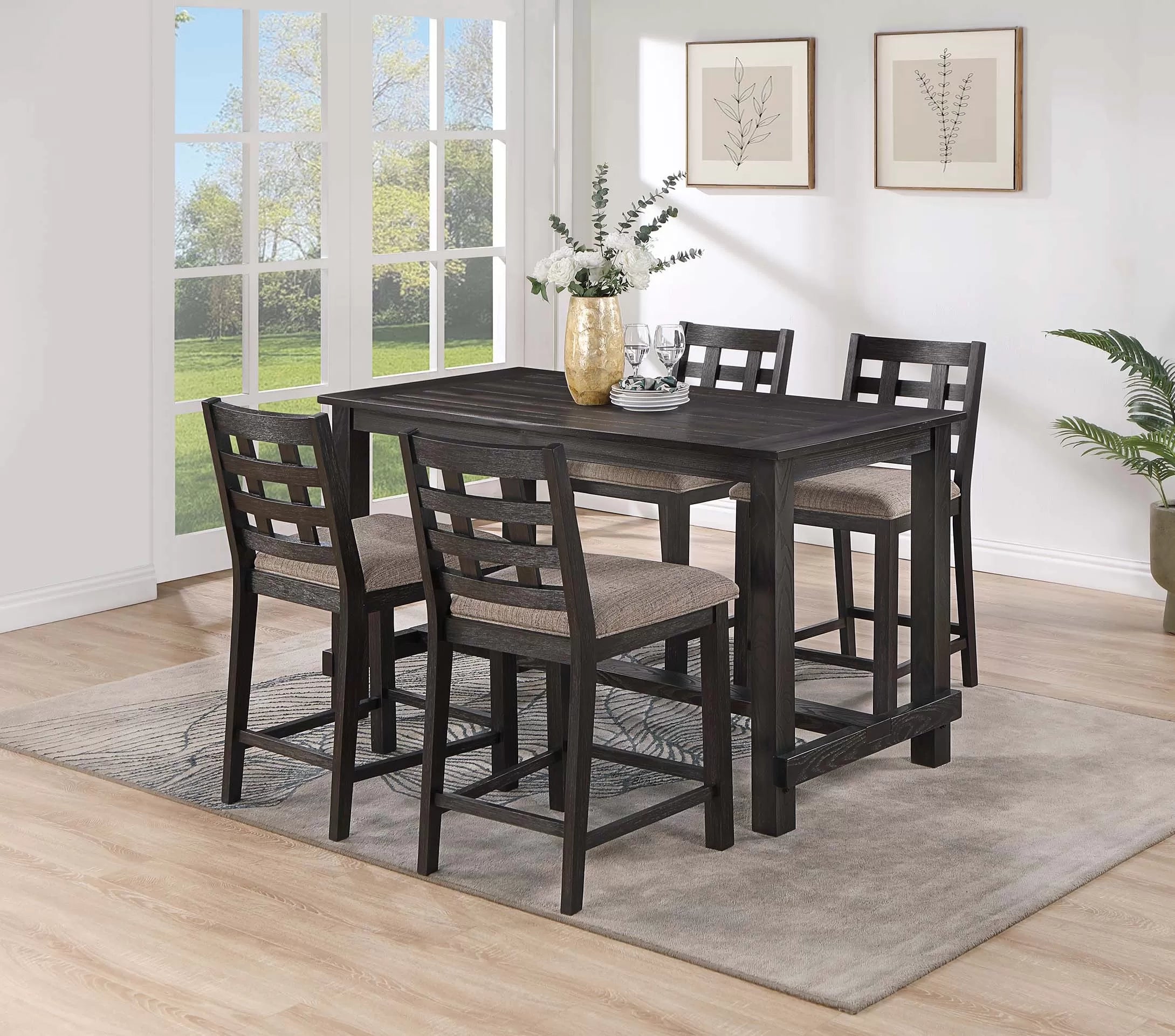 Dining room set with a dark wood table and chairs in a bright room.