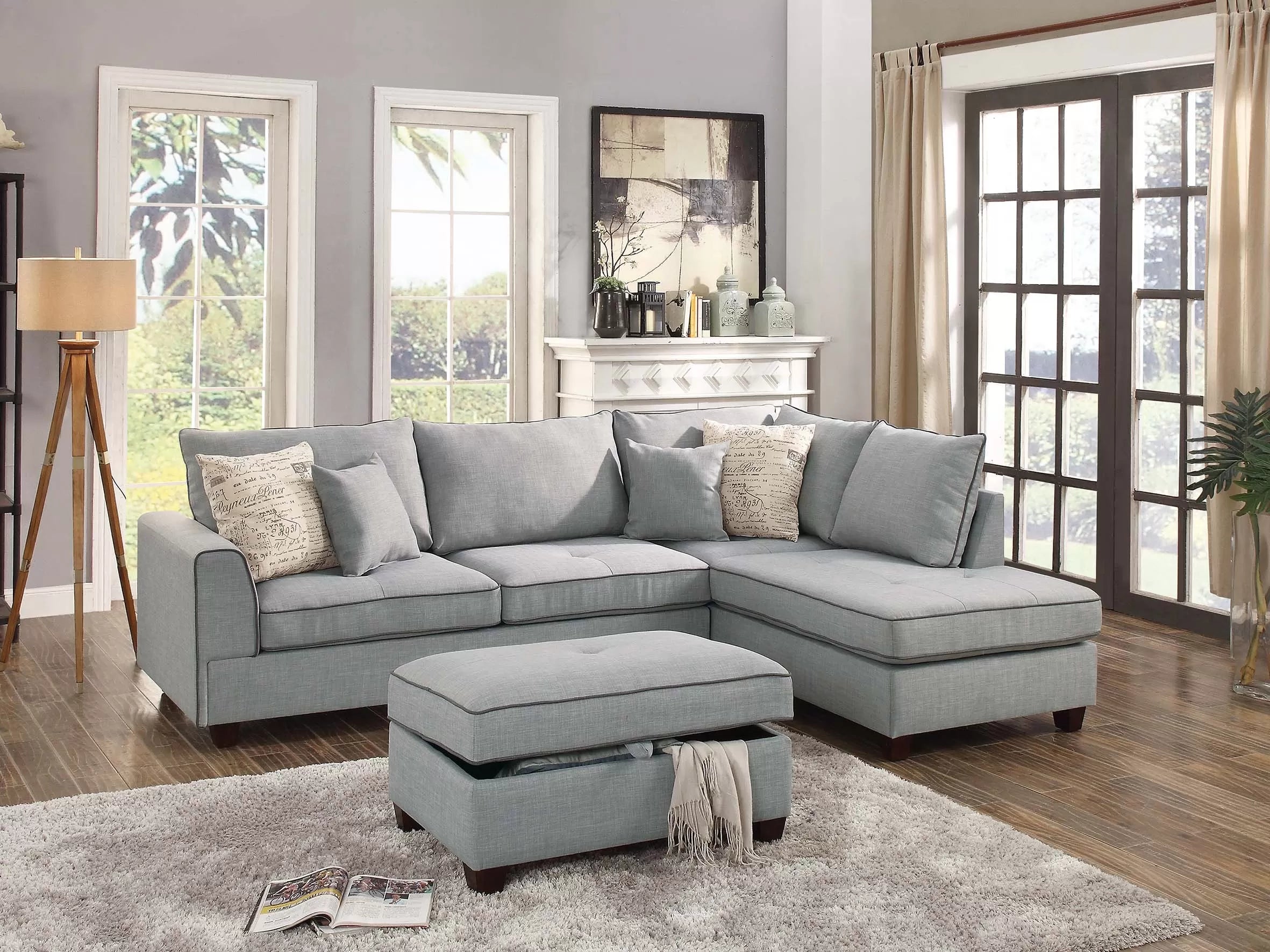 Gray sectional sofa with ottoman in a living room setting