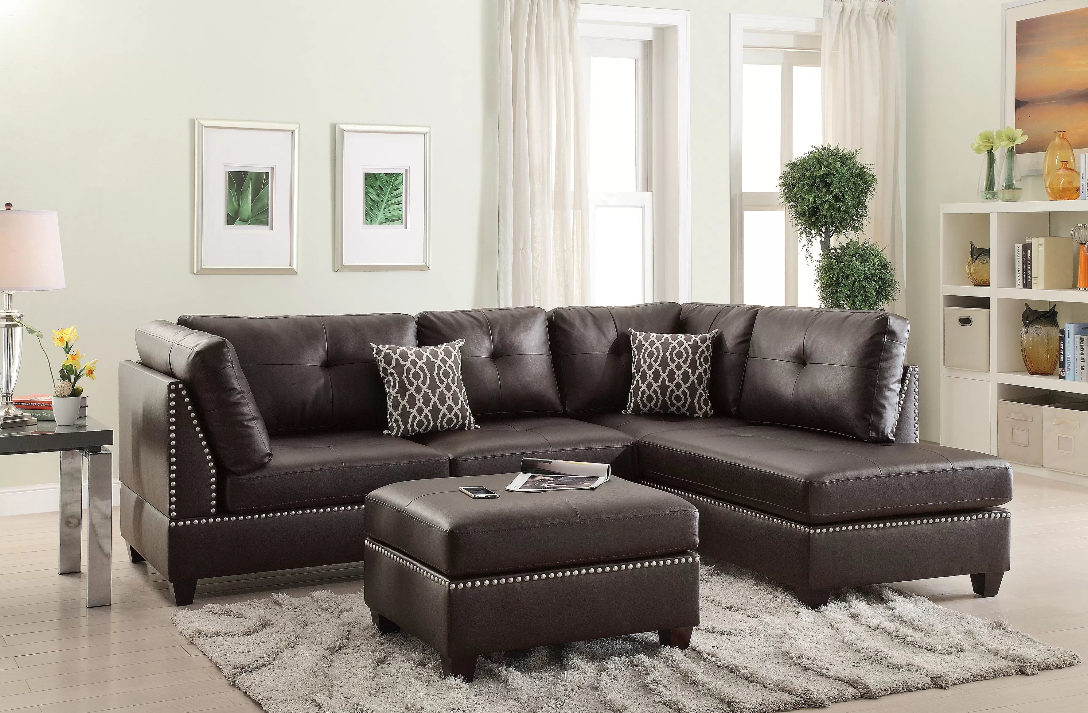 Brown sectional sofa with ottoman in a living room setting