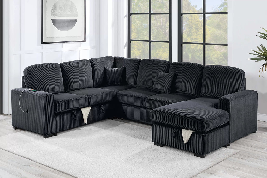 Gray sectional sofa in a room with large windows and a plant.