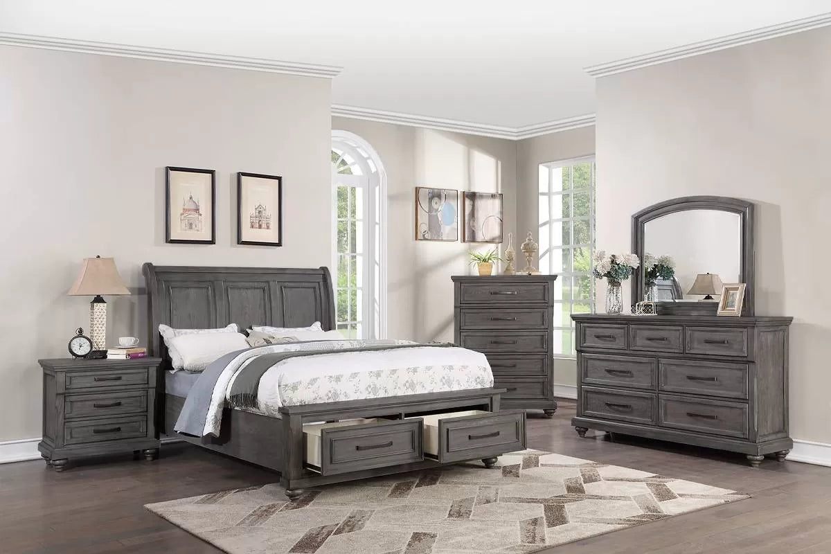 Gray bedroom furniture set with bed, dresser, and nightstands in a room.