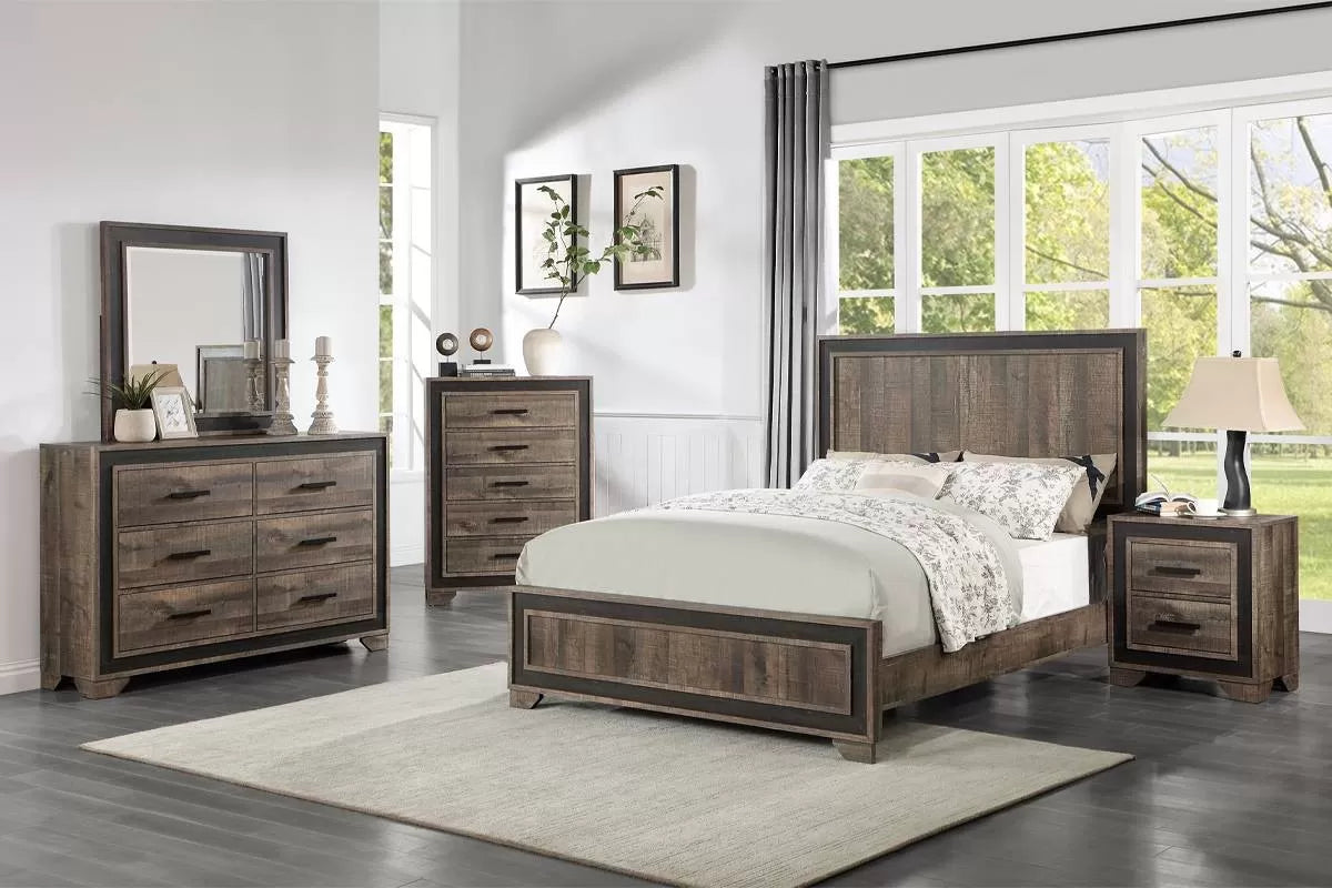 Wooden bedroom furniture set with bed, dressers, and mirror in a bright room.