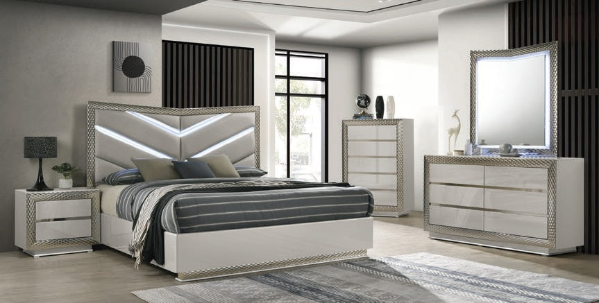 Modern bedroom set with bed, nightstands, dresser, and mirror in a well-lit room.