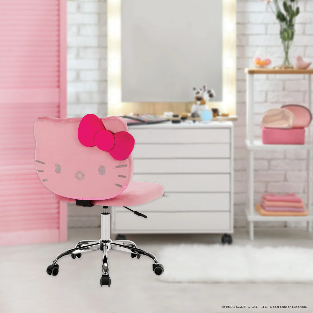 Pink Hello Kitty chair in a room with a white dresser and pink decor.