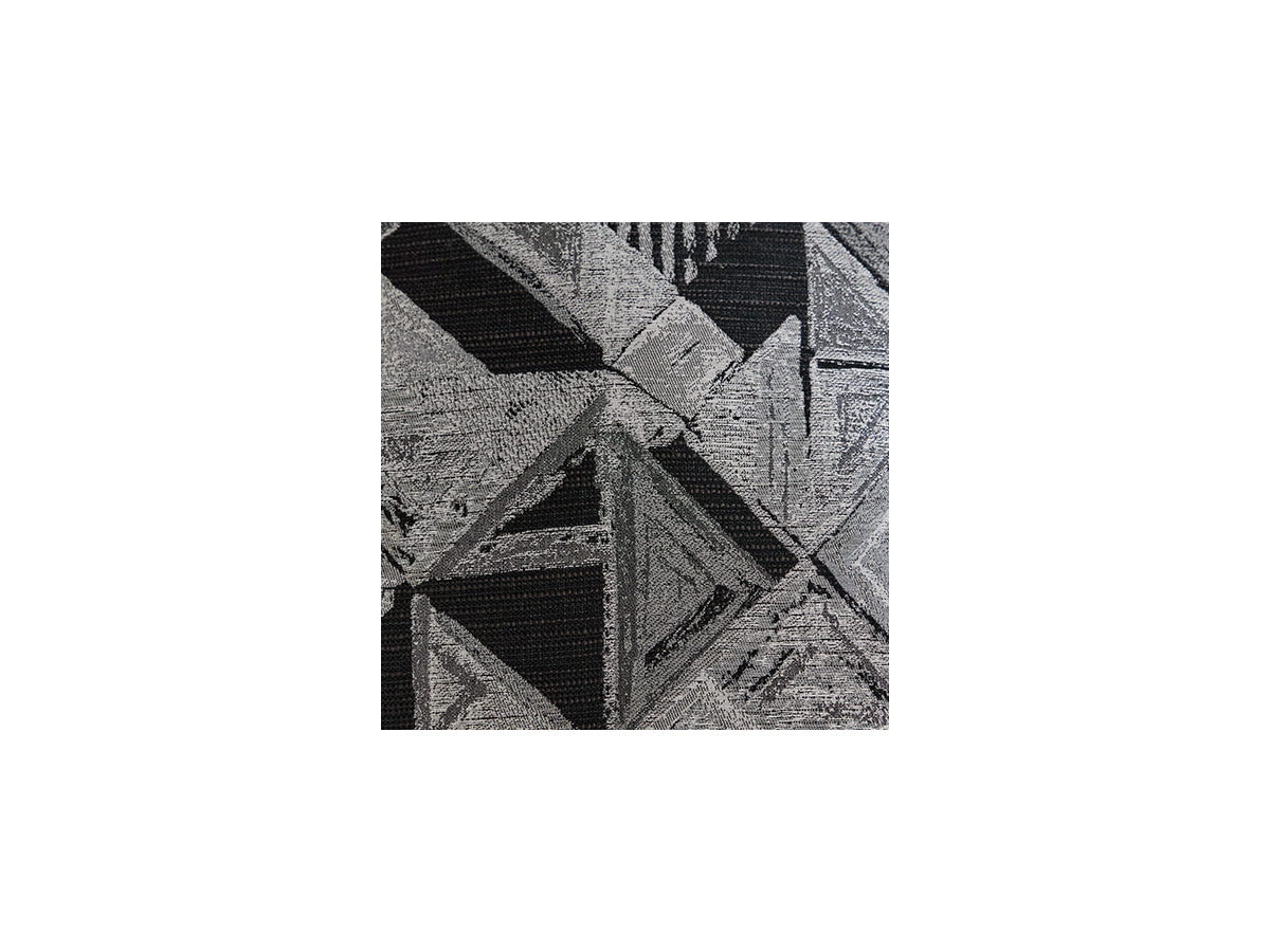 Black and white geometric pattern on a textured surface