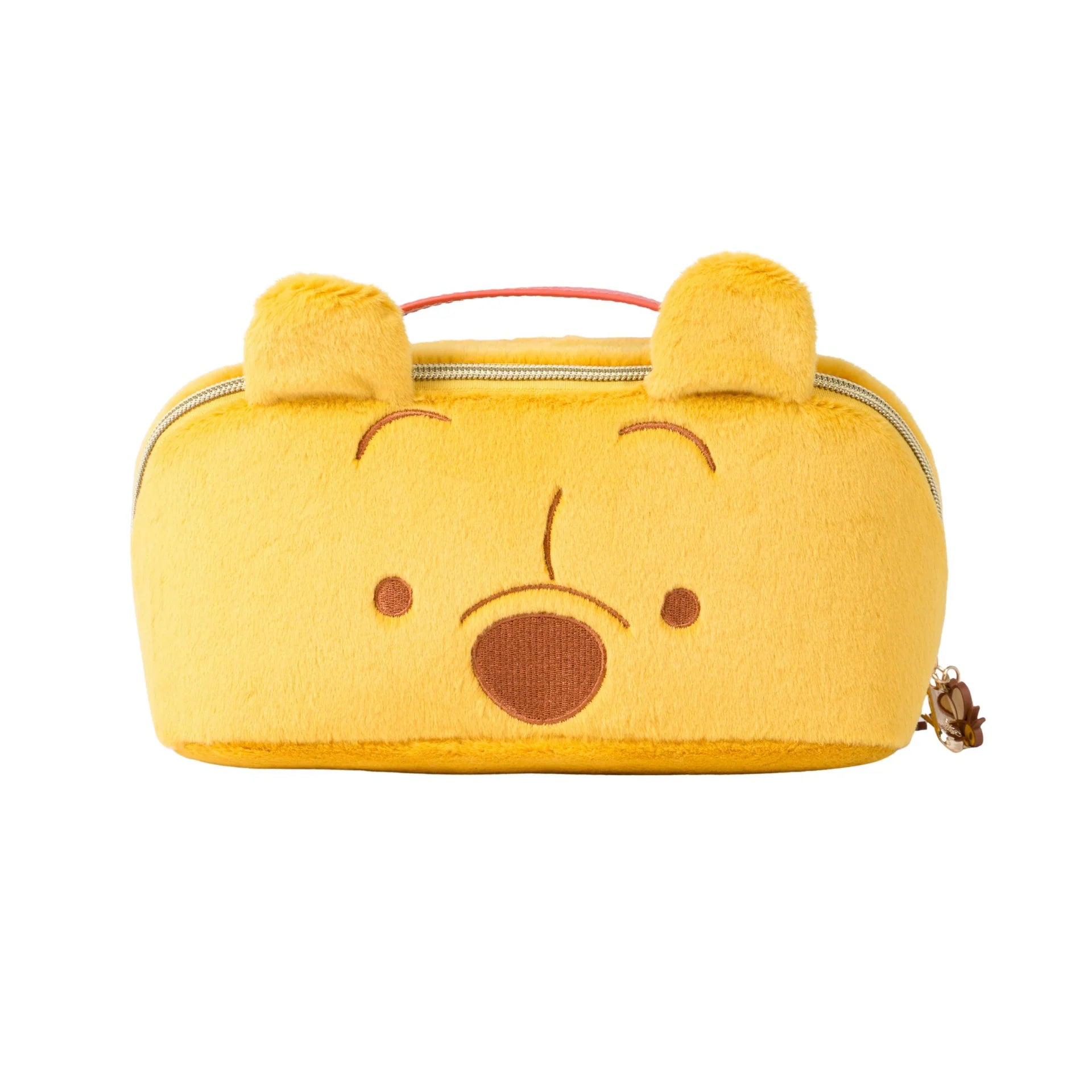 Yellow bear-shaped pouch with a smiley face on a white background