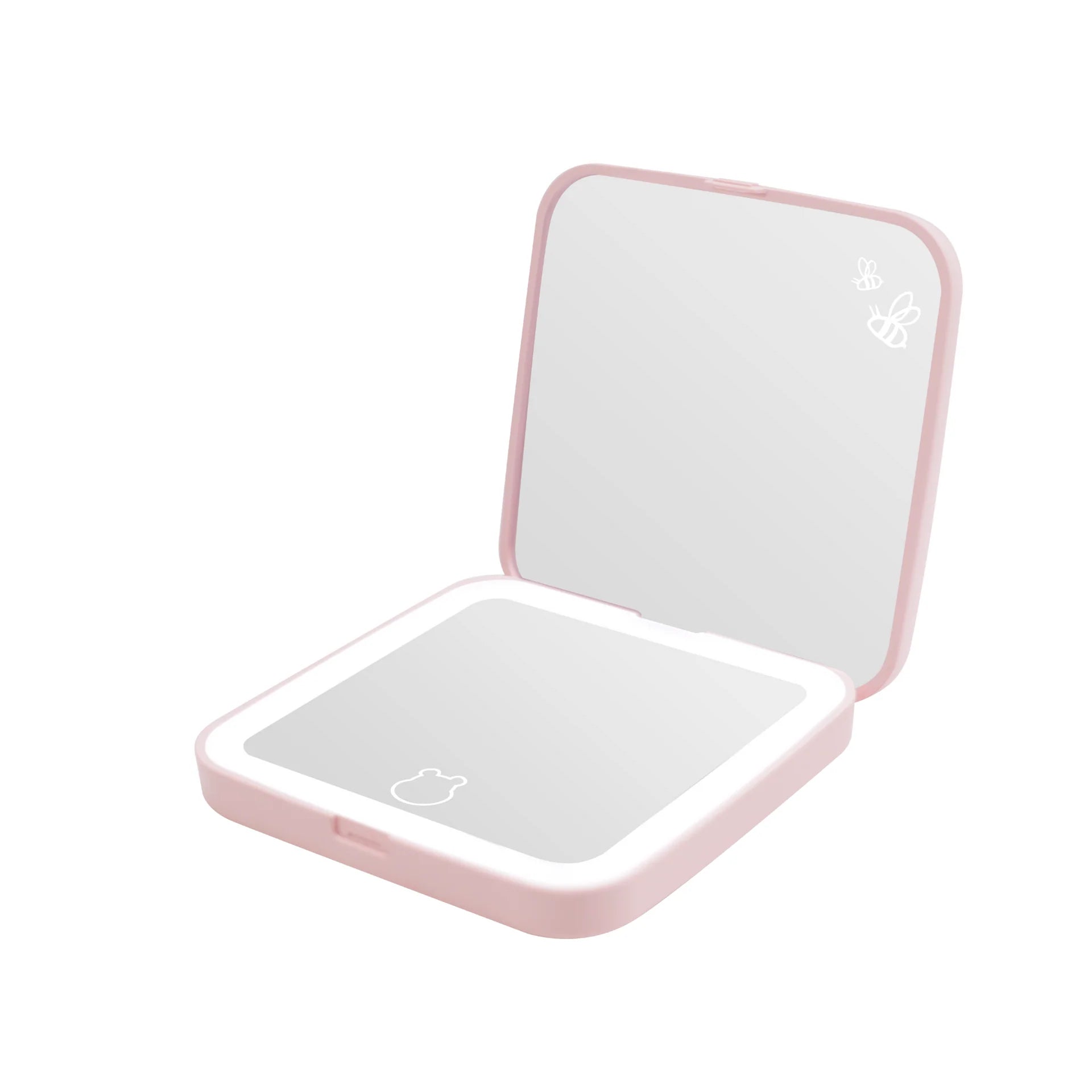 Pink compact mirror with LED lights on a white background