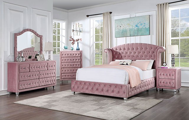 Pink bedroom set with tufted bed, dresser, and nightstands in a bright room.